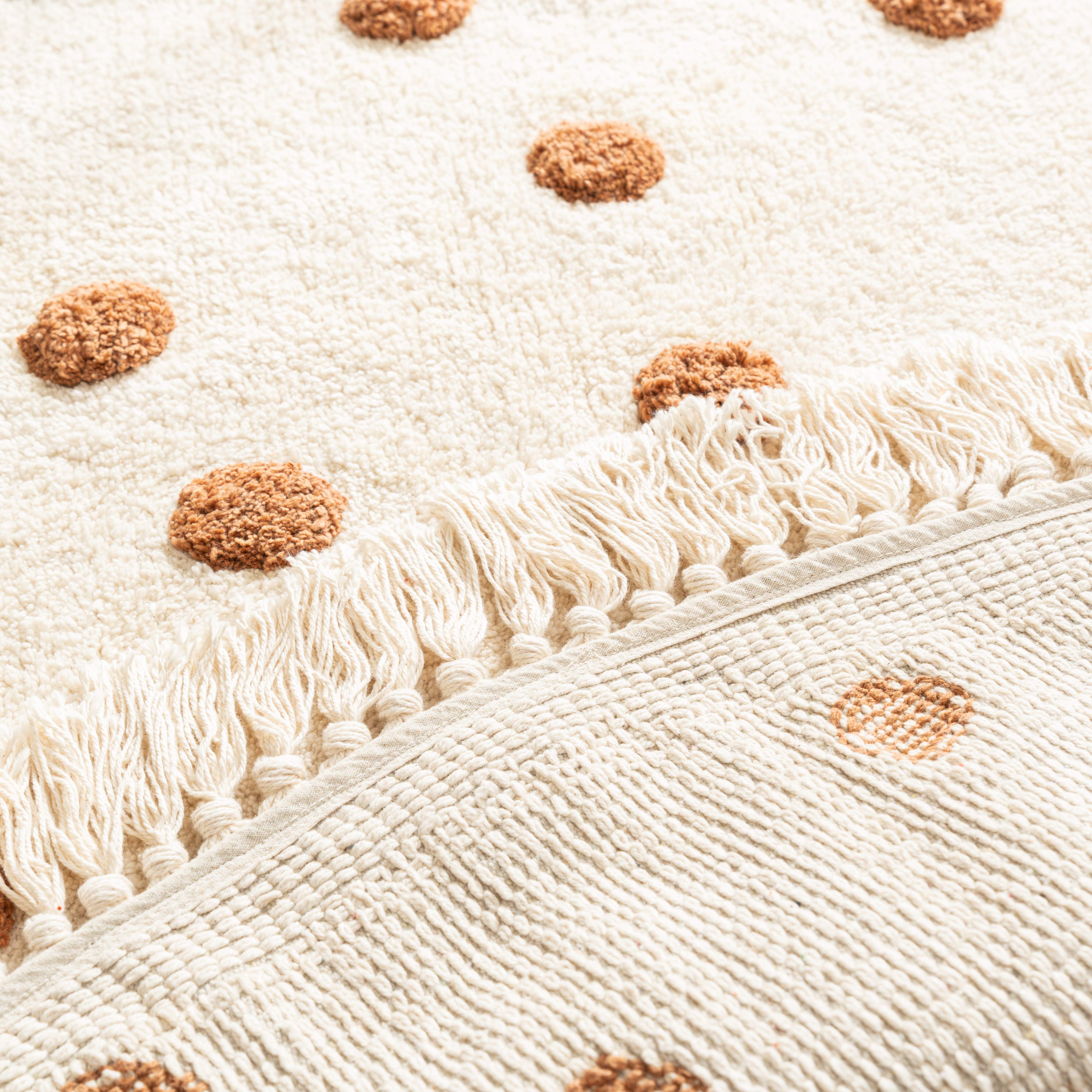 Back view of the handmade cotton polka dot rug, highlighting its quality craftsmanship and durability.